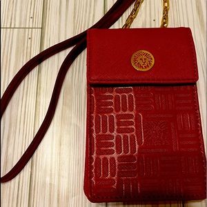 Anne Klein red crossbody wallet/cellphone holder. Never used